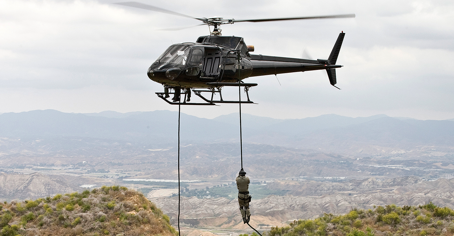 Eurocopter AS350 Ecureuil A-Star helicopter flying over Malibu, Calif., during a &lsquo;fast rope&rsquo;-type military operation.