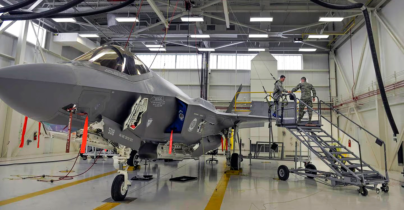 Airmen prepare an F-35A jet for maintenance at Eglin Air Force Base, Fla.