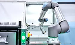 A CNC machine-tending Universal Robots UR30 cobot. A CNC machine-tending Universal Robots UR30 cobot.