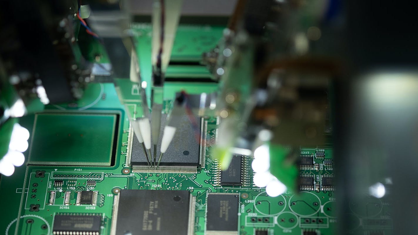 CNC machine solders the microchip to the motherboard.