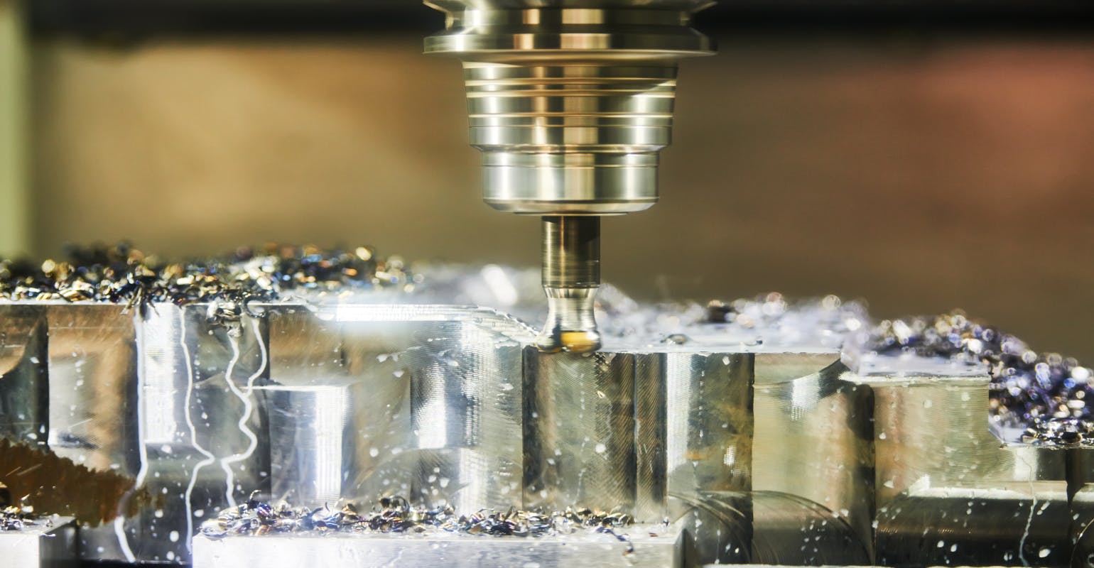 CNC milling in detail, with lubrication and coolant.