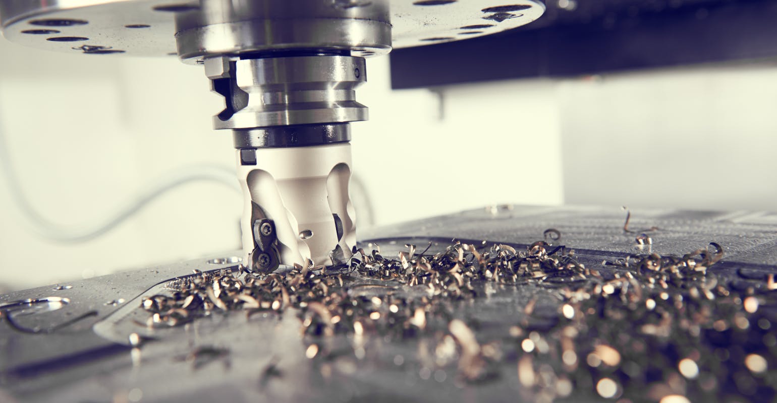 Close-up view of a milling cutter at work, CNC machining.