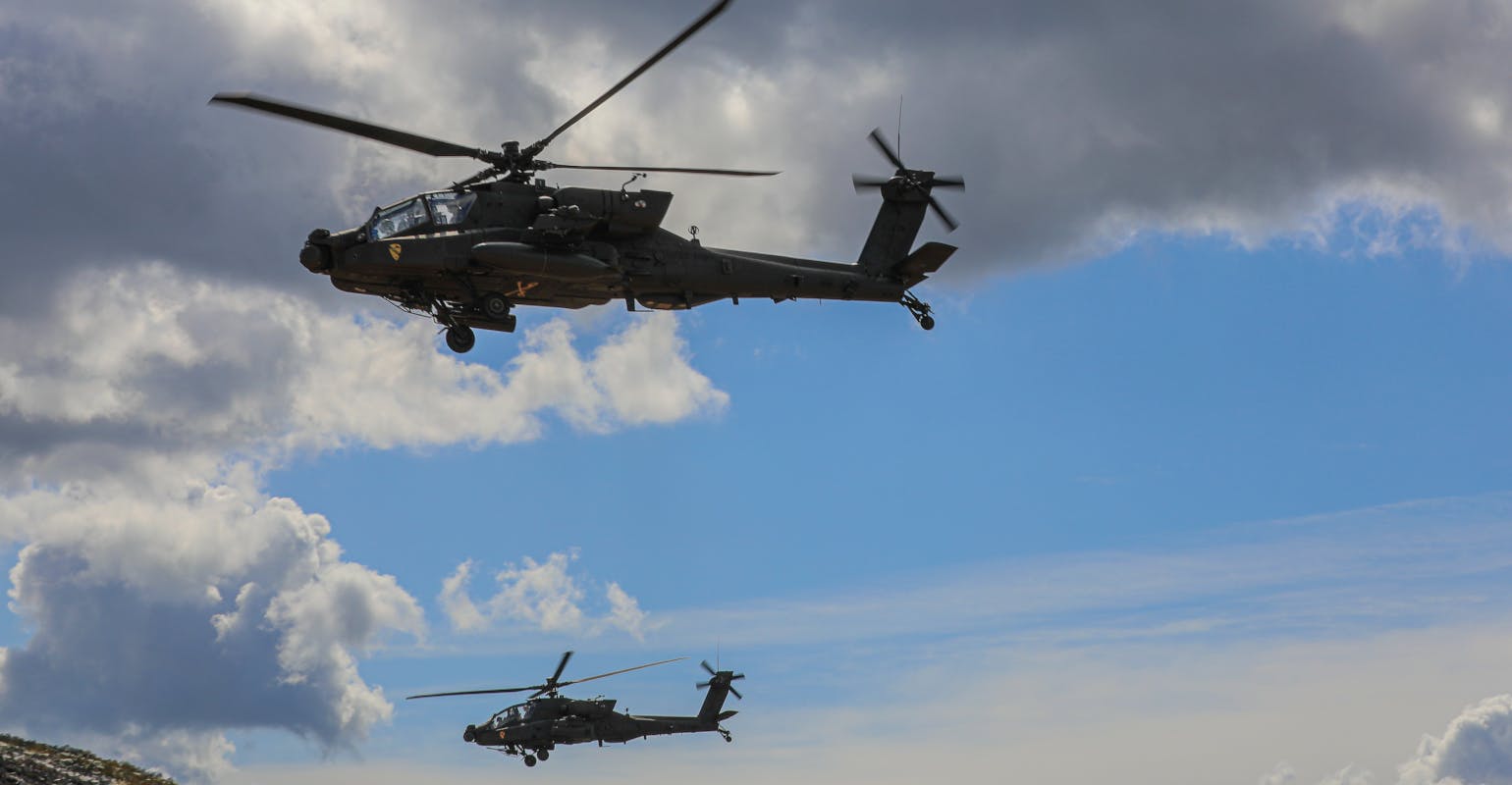 Boeing AH-64E Apache combat helicopters.