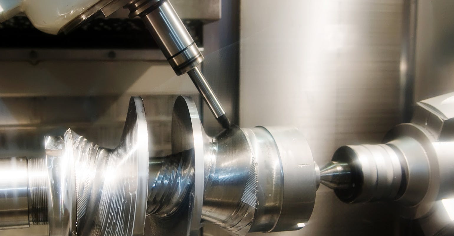 CNC drilling machine and workpiece.