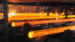 Con cast round steel billets on a runout table. Con cast round steel billets on a runout table.