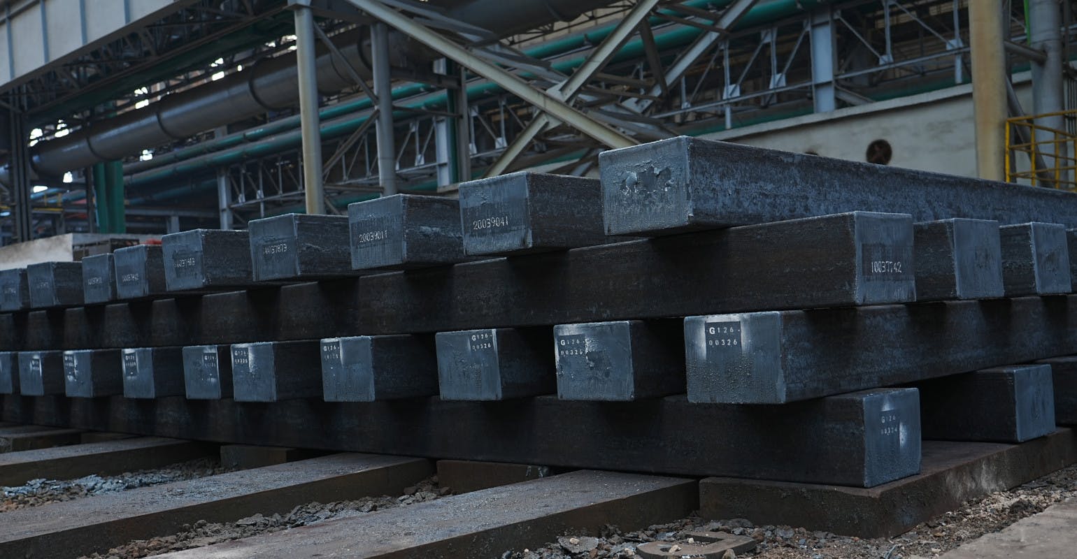 After high-temperature rolling, steel billets are stacked prior to storage or shipment.