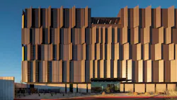 The west façade of the Pinal County Attorney's Office features a perforated metal panel. The west façade of the Pinal County Attorney's Office features a perforated metal panel.