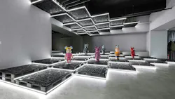 A lesson in melding retail and art, the experiential space—part retail, part art gallery—can display menswear one day, and then change it out completely to exhibit pop art, such as collectible Be@rbrick figurines, seen here, the very next day. A lesson in melding retail and art, the experiential space—part retail, part art gallery—can display menswear one day, and then change it out completely to exhibit pop art, such as collectible Be@rbrick figurines, seen here, the very next day.