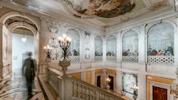 At Palazzo Grassi, low-profile spotlights illuminate the grand marble staircase with original frescos. At Palazzo Grassi, low-profile spotlights illuminate the grand marble staircase with original frescos.