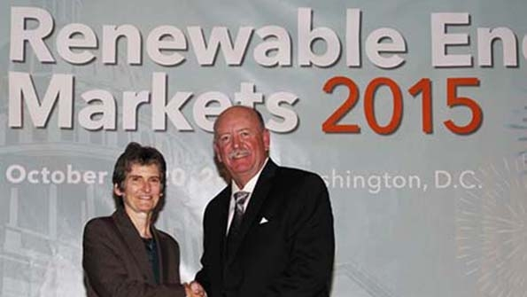 Stuart Duncan chief operations officer with the Tucson school district accepts a Green Power Partner of the Year award from the EPA