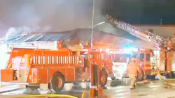 Firefighters work to extinguish flames at Dover High School Firefighters work to extinguish flames at Dover High School