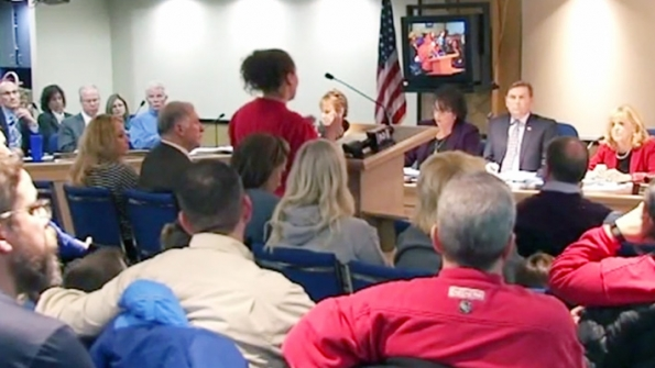 The Livonia school board listens to public comments prior to deciding to close 2 elementary schools