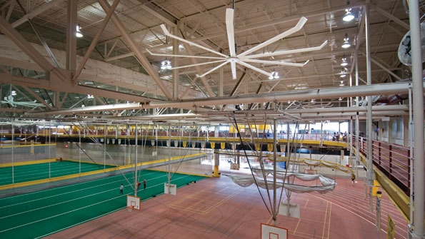Iowa State University solved comfort and IAQ issues resulting from stagnant hot air with a natural ventilation approach by installing 10 ceiling fans of various sizes around the upper indoor track in its recreation facility Photo Big Ass Fans