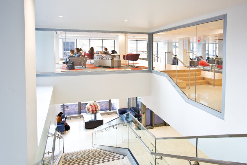 Fire-rated glazing in Alan Magee Scaife Hall preserves open sightlines and access to daylight around central staircase.