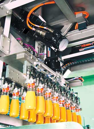 This highly synchronized bottle-filling machine from SIG Asbofill stops motion without cutting power to the controller and upset