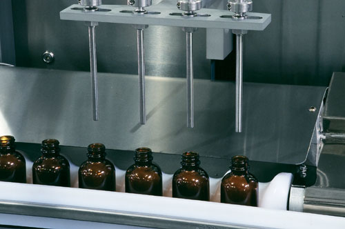 Servo drives and motors are keys to the flexibility in the filler/capper.