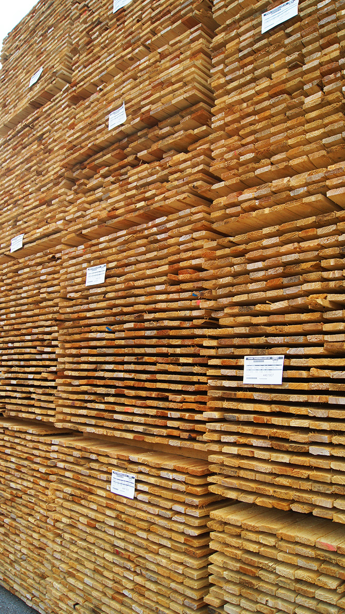 Sawmill processing stations turn logs into finished lumber for crates and pallets.