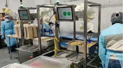 Two Chef system robots operate next to each other in this food tray assembly area at Sunbasket. Two Chef system robots operate next to each other in this food tray assembly area at Sunbasket.