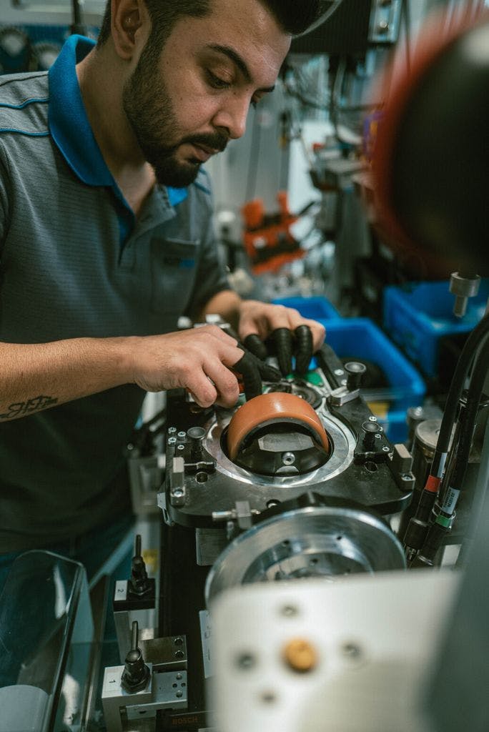 Assembly work at the ebm-pabst facility in Lauf an der Pegnitz, Germany.