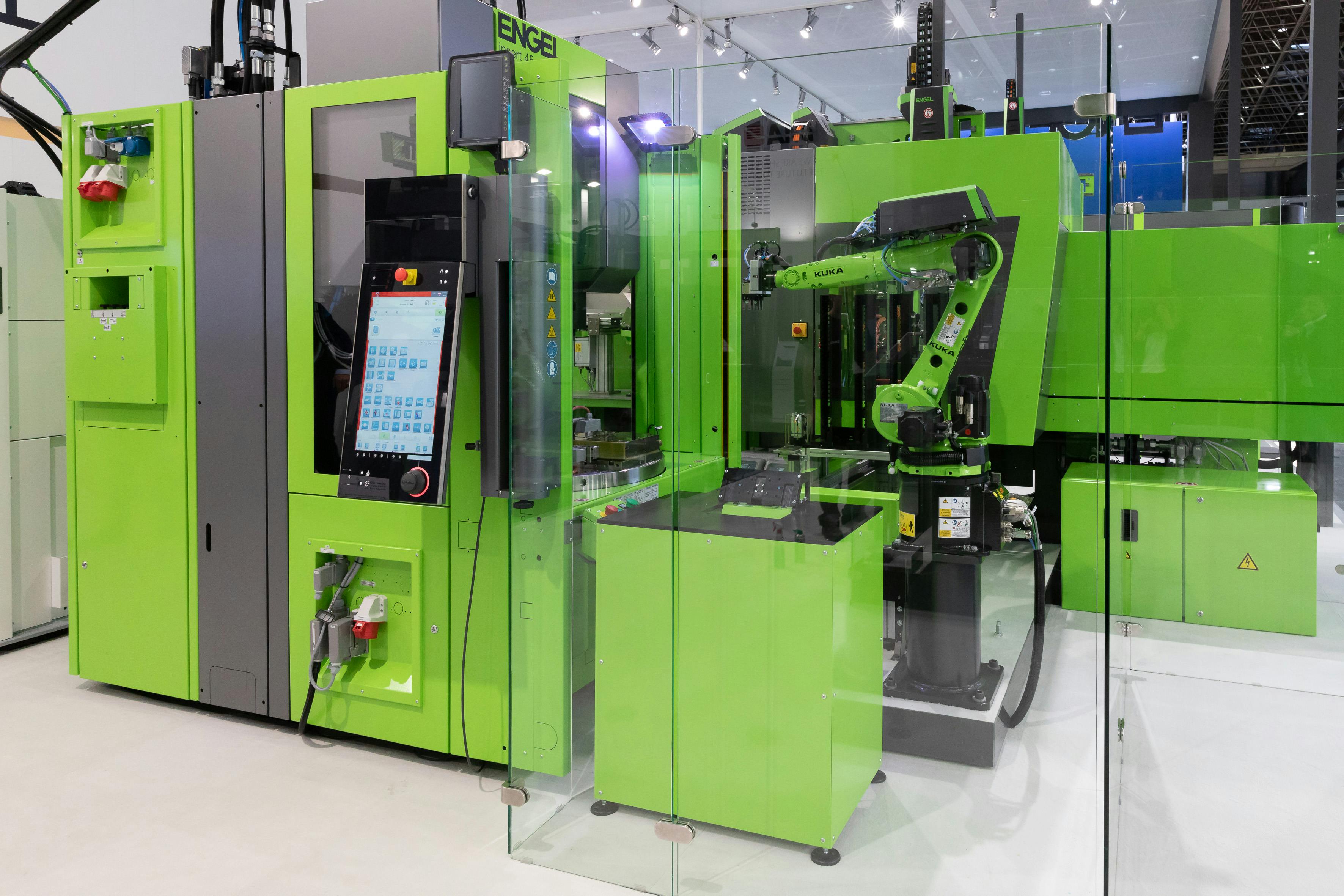 Engel injection molding equipment featuring KUKA robots.