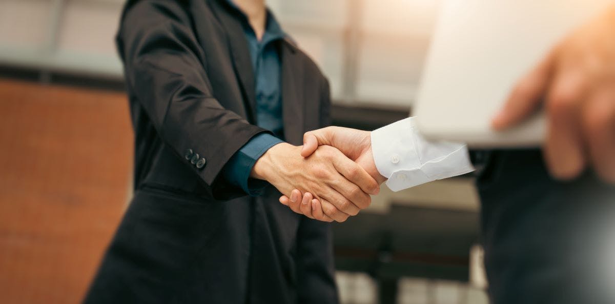 Businessman handshake for teamwork of business merger and acquisition