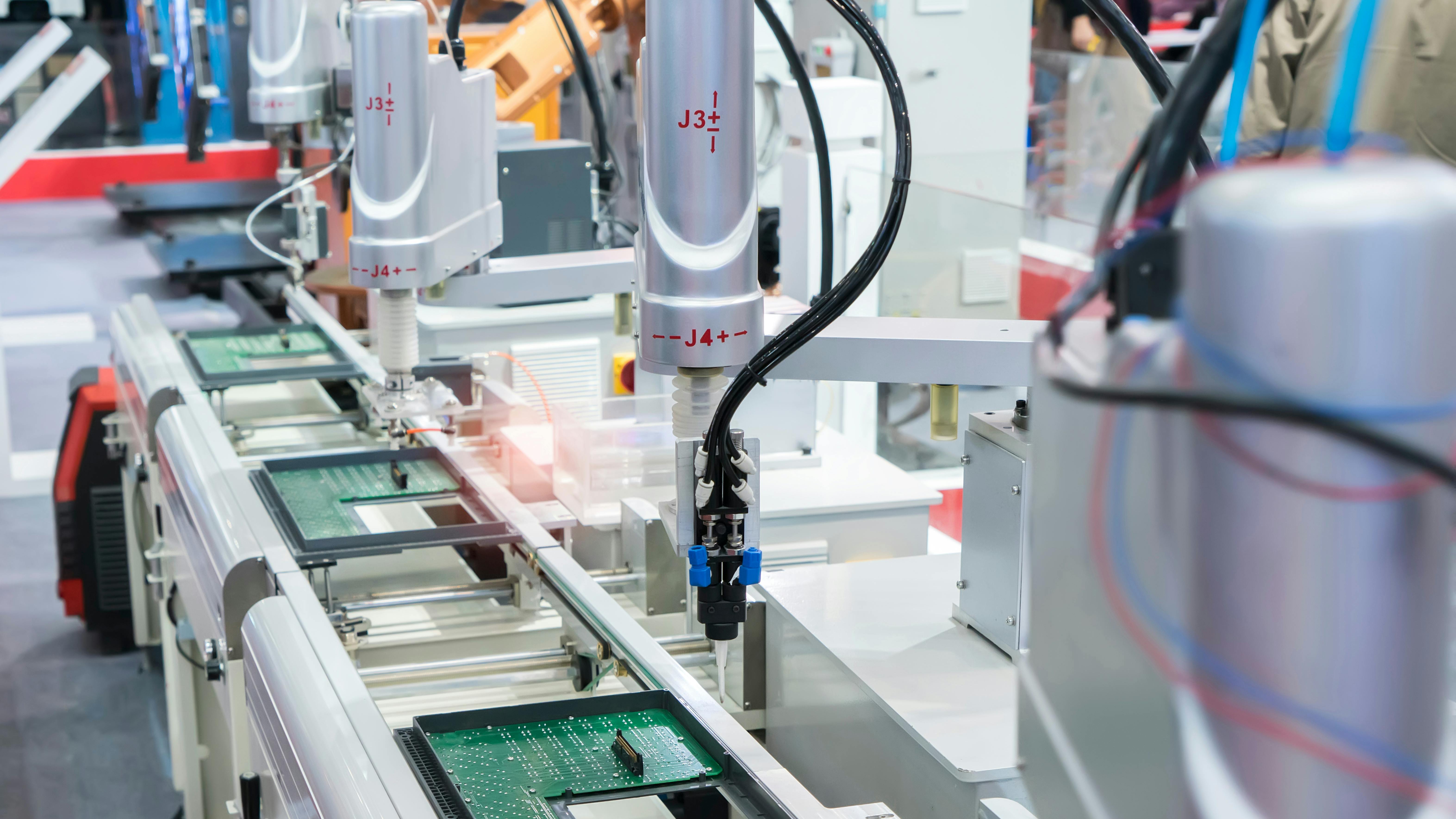 robots with vision systems in electronics assembly