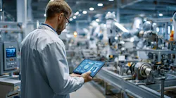 worker reviews production operations data via a consolidated platform worker reviews production operations data via a consolidated platform