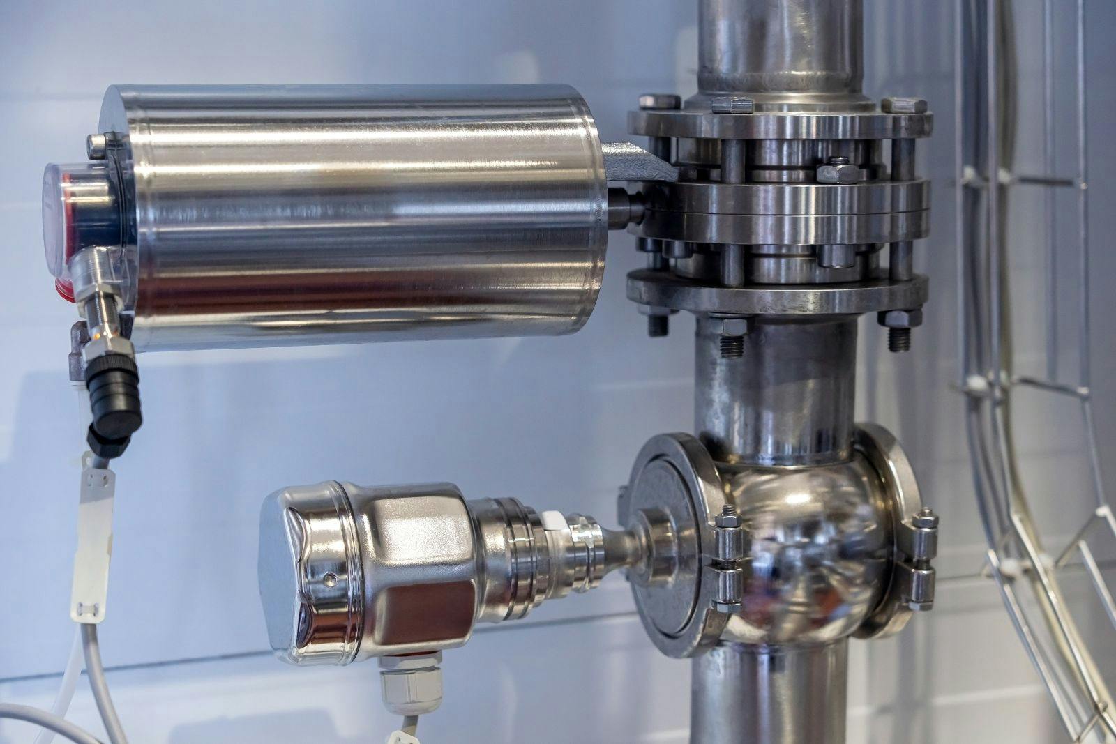 Stainless steel electric actuator with butterfly valve and solenoid valve on pipeline.