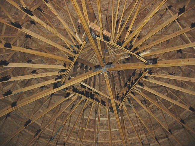 Wood truss ceiling in a salt storage building
