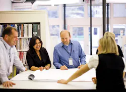 EYP Architecture & Engineering designers review drawings for a historic preservation project. The firms in-house education foru EYP Architecture & Engineering designers review drawings for a historic preservation project. The firms in-house education foru