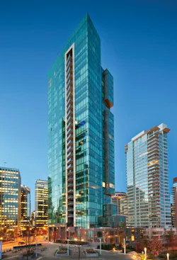 The 33-story Three Harbour Green tower is the final piece of a three-building development fronting seven acres of waterfront park space in Vancouver. IBI Group provided architectural and interior design services on the project, which incorporates residential units on the west side of the tower and office space on the east portion. The two functions are divided on the exterior by a series of stone-clad sky gardens hanging off the building. PHOTO: BOB MATHESON The 33-story Three Harbour Green tower is the final piece of a three-building development fronting seven acres of waterfront park space in Vancouver. IBI Group provided architectural and interior design services on the project, which incorporates residential units on the west side of the tower and office space on the east portion. The two functions are divided on the exterior by a series of stone-clad sky gardens hanging off the building. PHOTO: BOB MATHESON