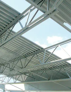 Installation of steel deck (here, from manufacturer New Millennium Building Systems) in progress. For additional technical infor Installation of steel deck (here, from manufacturer New Millennium Building Systems) in progress. For additional technical infor