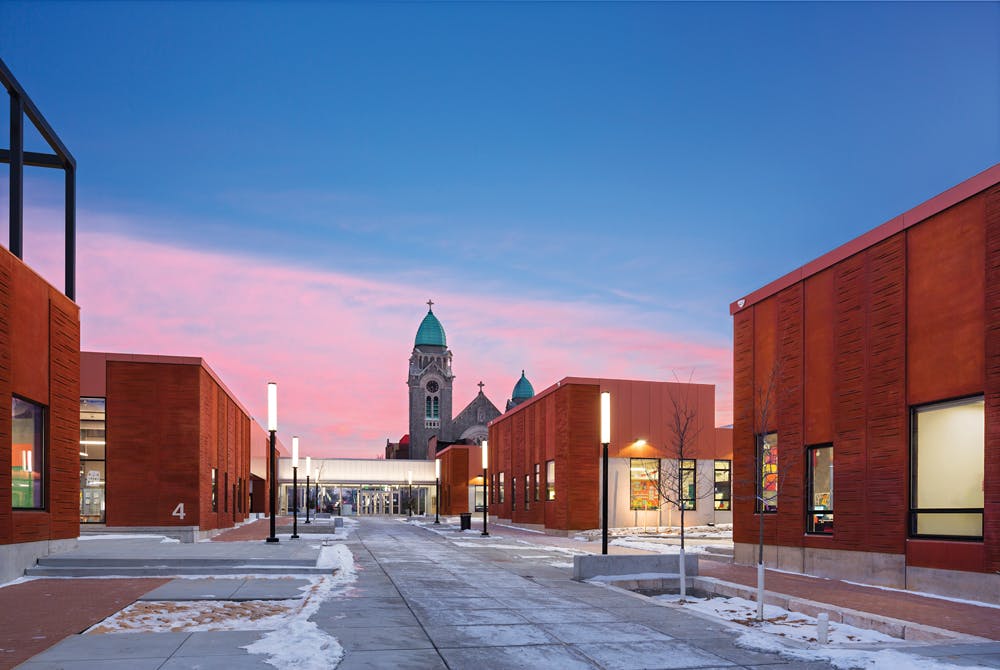 Low-rise structures and pedestrian streets characterize the new Henderson-Hopkins School in East Baltimore, the areas first new