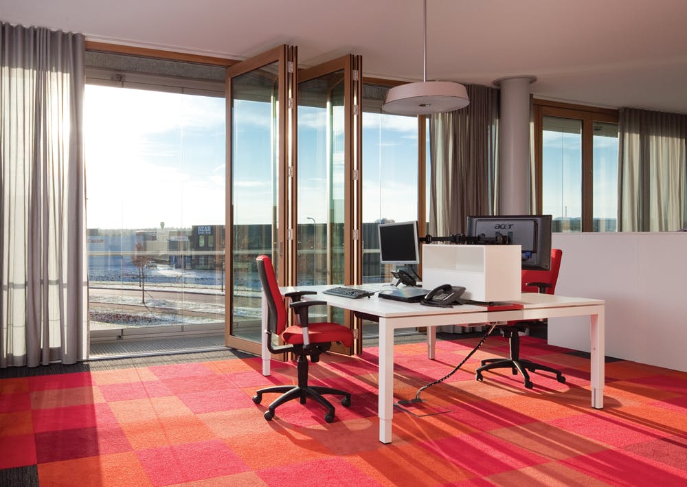 To naturally heat the perimeter at Solarluxs new administration building in the Netherlands, a sophisticated operable double fa