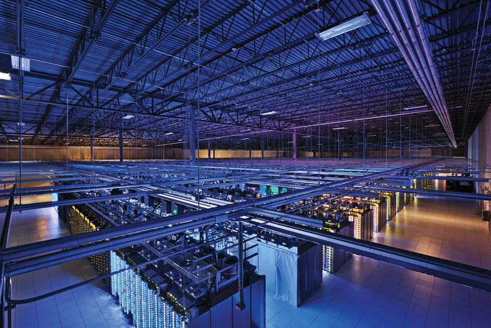 Googles data centers include this massive server room in Council Bluffs, Iowa. The company operates some 900,000 servers in abo