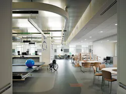 Metal tiles were used in the physical therapy gymnasium to give the space a more rugged feel for recovering soldiers. Harnesses Metal tiles were used in the physical therapy gymnasium to give the space a more rugged feel for recovering soldiers. Harnesses