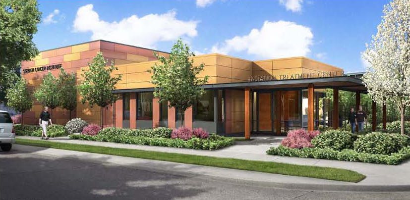 The facility combines a specialized therapy room or vault to house the TomoTherapy treatment system with patient and clinical