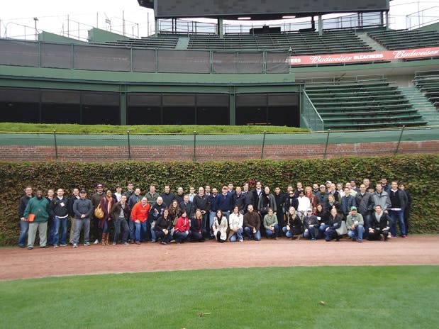 Dont touch the ivyits historic! The U40 Leadership Summit participants assembled before the 400-foot centerfield sign at Wrig