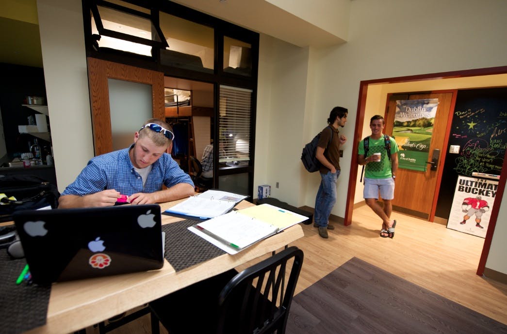 A student bedroom at the College of Wooster (Ohio) capitalizes on 12-foot-high ceilings to optimize overhead storage space, extr