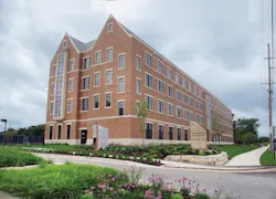 Precast units from Coreslab Structures (left) being put in place at Valparaiso (Ind.) Universitys new student residence. A bath Precast units from Coreslab Structures (left) being put in place at Valparaiso (Ind.) Universitys new student residence. A bath