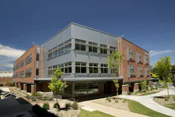 Metal wall panels’ deep shadow lines break up massing of Georgia school Metal wall panels’ deep shadow lines break up massing of Georgia school