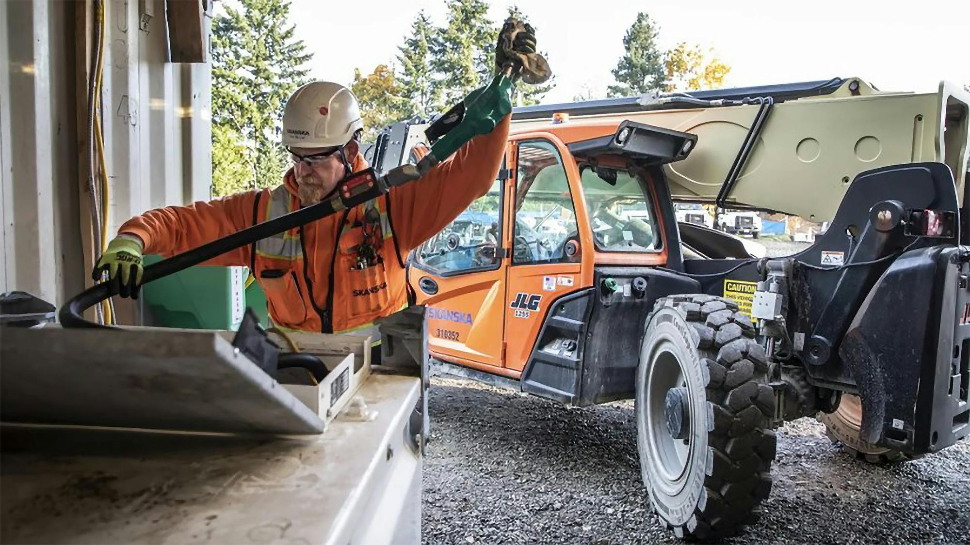 Pete Van Lier Replaces A Hose After Filling A Forklift With Plant Based Diesel At Our Construction Yard In Mountlake Terrace