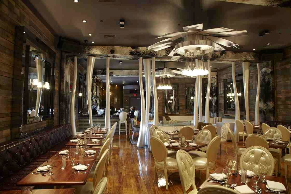 Osso's Walls Feature Barn Wood Finishes, Fabric And Cowhide Coverings, Inset Back Lighting And Hand Cut Mirrors