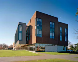 Through the use of sand cast red brick, oak doors, and a warm natural color palette, the building maintains a strong connection Through the use of sand cast red brick, oak doors, and a warm natural color palette, the building maintains a strong connection