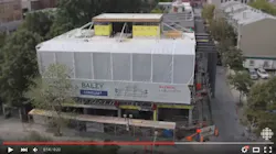 Multifamily building in downtown Montreal is being built from the roof down Multifamily building in downtown Montreal is being built from the roof down