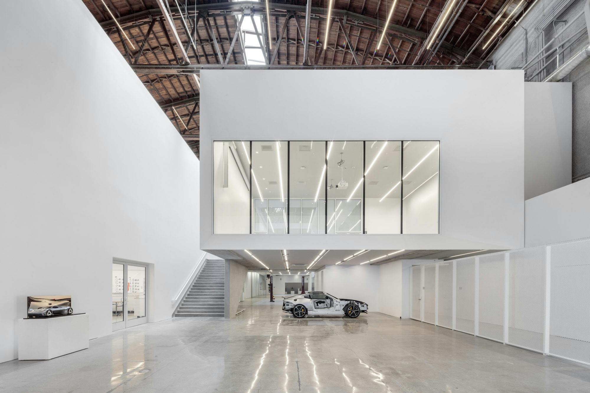 This image from the Fabrication Lab on level one features a &ldquo;cut away&rdquo; Jaguar F-Type and shows the hovering flexible lecture / gallery space above. Photo: Joshua White