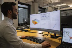 Man works in front of a computer Man works in front of a computer