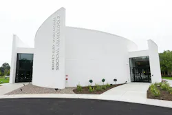 Closeup of white building with curved walls and an entrance on each side with “Canterbury Performing Arts Center” on the front Closeup of white building with curved walls and an entrance on each side with “Canterbury Performing Arts Center” on the front