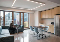 Person sitting in modern multifamily affordable apartment Person sitting in modern multifamily affordable apartment