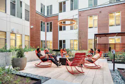 TEMPO student housing, people around a fire pit TEMPO student housing, people around a fire pit